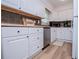 Well-lit kitchen features white cabinets, stainless steel appliances, and neutral countertops at 4529 Lakeview Dr, Powder Springs, GA 30127