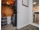 Well-organized laundry area with modern appliances and shelving for storage, adjacent to kitchen at 4529 Lakeview Dr, Powder Springs, GA 30127