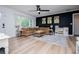 Comfortable living room with a large sectional sofa, modern decor, and stylish laminate flooring at 4529 Lakeview Dr, Powder Springs, GA 30127