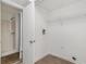 Bright laundry room with wood-look flooring and a closet containing a stand-up shower at 5444 Wylstream, Norcross, GA 30093
