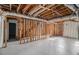 Unfinished basement with exposed framing, ready for customization and storage space at 7935 Sweetwater Dr, Douglasville, GA 30135