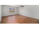 Spacious bedroom with wood-look flooring, a ceiling fan, and natural light from a window at 7935 Sweetwater Dr, Douglasville, GA 30135