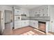 Clean kitchen features white cabinetry, stone countertops, and stainless steel appliances at 7935 Sweetwater Dr, Douglasville, GA 30135