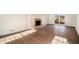 Bright living room with fireplace, hardwood floors and sunlit windows at 7935 Sweetwater Dr, Douglasville, GA 30135