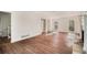 Spacious living room with hardwood floors, natural light, and a traditional fireplace at 7935 Sweetwater Dr, Douglasville, GA 30135