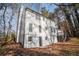 Side view of home with access to deck and walkout basement door, bright exterior, and lots of natural light at 7935 Sweetwater Dr, Douglasville, GA 30135