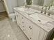 Bathroom vanity with double sinks and a granite countertop at 110 Orleans Blvd, Mcdonough, GA 30253