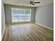 This light-filled bedroom has large window, and updated laminate flooring at 110 Orleans Blvd, Mcdonough, GA 30253