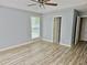 Bright bedroom with updated floors and a ceiling fan fixture at 110 Orleans Blvd, Mcdonough, GA 30253