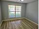 Bedroom with durable light-colored floors and bright window at 110 Orleans Blvd, Mcdonough, GA 30253