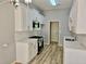 Modern kitchen with white cabinets, stainless steel appliances, stone countertops, and attractive new backsplash at 110 Orleans Blvd, Mcdonough, GA 30253