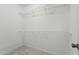 Walk-in closet with wire shelving, providing ample storage for clothing and personal items at 1214 Lake Pointe Cir, Roswell, GA 30075