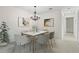 Bright dining area with a chandelier and stylish furniture, ideal for Gathering meals and gatherings at 1214 Lake Pointe Cir, Roswell, GA 30075