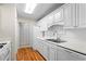 Well-maintained kitchen featuring white cabinetry, countertops, and modern appliances for the home chef at 1214 Lake Pointe Cir, Roswell, GA 30075