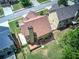 Aerial shot of a house with a deck and a large lawn that borders a wooded area at 233 Yorkshire Ln, Villa Rica, GA 30180