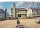 This backyard includes a fire pit, small deck, and an abundance of space at 233 Yorkshire Ln, Villa Rica, GA 30180