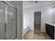 Bathroom features glass shower, soaking tub, and a modern vanity with a tiled floor at 233 Yorkshire Ln, Villa Rica, GA 30180