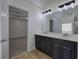 Bathroom showcases a double vanity and modern fixtures, with access to walk-in closet at 233 Yorkshire Ln, Villa Rica, GA 30180