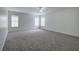 Large, bright bedroom with plush carpeting and ample natural light from multiple windows at 233 Yorkshire Ln, Villa Rica, GA 30180
