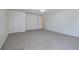 Spacious bedroom with neutral walls, plush carpeting, and access to other rooms at 233 Yorkshire Ln, Villa Rica, GA 30180