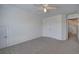 Spacious bedroom with carpet floors, light walls, a ceiling fan, and closet at 233 Yorkshire Ln, Villa Rica, GA 30180