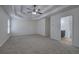 Large bedroom boasts plush carpeting, a ceiling fan, and access to an en-suite bathroom at 233 Yorkshire Ln, Villa Rica, GA 30180