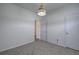 Neutral bedroom with carpet, a simple light fixture, and two doors in a freshly painted color at 233 Yorkshire Ln, Villa Rica, GA 30180