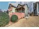Well-maintained home with a two-car garage, porch, and lush landscaping at 233 Yorkshire Ln, Villa Rica, GA 30180