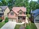Charming brick home with a two-car garage and a welcoming front porch at 233 Yorkshire Ln, Villa Rica, GA 30180