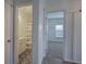 Hallway view to bathroom with patterned floor and bedroom with new carpet at 233 Yorkshire Ln, Villa Rica, GA 30180