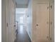 Clean hallway with neutral paint and flooring, showcasing access to multiple rooms at 233 Yorkshire Ln, Villa Rica, GA 30180