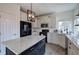 Bright kitchen featuring stone countertops, stainless appliances, and a stylish island with wooden shelves at 233 Yorkshire Ln, Villa Rica, GA 30180