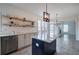 Kitchen with central island, granite countertops, and hardwood-style flooring that opens to a living space at 233 Yorkshire Ln, Villa Rica, GA 30180