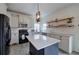 Well-lit kitchen with a center island, granite countertops, and modern appliances at 233 Yorkshire Ln, Villa Rica, GA 30180