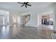 Expansive living room with hardwood floors, a ceiling fan, and an open floor plan to other rooms at 233 Yorkshire Ln, Villa Rica, GA 30180