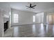 Bright living room with a fireplace, hardwood floors, and an open layout flowing to other rooms at 233 Yorkshire Ln, Villa Rica, GA 30180