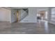 Open-concept layout showing hardwood floors, stairs, and a view into the kitchen area at 233 Yorkshire Ln, Villa Rica, GA 30180
