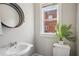 Well-lit powder room features a vintage sink, and a decorative mirror at 322 Peters Sw St # 6, Atlanta, GA 30313