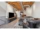 Modern living room with exposed beams and ductwork, open to kitchen and stairway at 322 Peters Sw St # 6, Atlanta, GA 30313