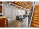 Open-concept living room with exposed beam ceiling, hardwood floors, and industrial-chic design elements at 322 Peters Sw St # 6, Atlanta, GA 30313