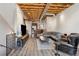 Inviting living room with exposed ceiling beams, hardwood floors, and comfortable seating at 322 Peters Sw St # 6, Atlanta, GA 30313