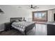 Spacious primary bedroom with a brick accent wall, large windows, and ample natural light at 322 Peters Sw St # 6, Atlanta, GA 30313