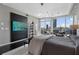 Comfortable bedroom with city views, stylish decor, and dark hardwood floors at 3325 Piedmont Ne Rd # 3005, Atlanta, GA 30305