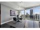Elegant dining area with city views, modern chandelier, and sleek furnishings create a sophisticated ambiance at 3325 Piedmont Ne Rd # 3005, Atlanta, GA 30305