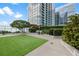 Well-maintained dog run with green space and shade trees, perfect for pet owners at 3325 Piedmont Ne Rd # 3005, Atlanta, GA 30305
