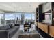 Modern living room with hardwood floors, large windows with city views, and contemporary furniture at 3325 Piedmont Ne Rd # 3005, Atlanta, GA 30305