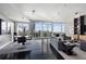 Spacious living area featuring hardwood floors, contemporary furnishings, and panoramic city views at 3325 Piedmont Ne Rd # 3005, Atlanta, GA 30305