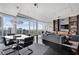 Open living and dining space with expansive city views, modern furnishings, and stylish decor at 3325 Piedmont Ne Rd # 3005, Atlanta, GA 30305