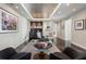 Bright living room featuring recessed lights, modern decor, and a cozy seating arrangement on a large rug at 3325 Piedmont Ne Rd # 3005, Atlanta, GA 30305