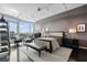Serene bedroom offers city views, dark floors, ample seating, and neutral tones at 3325 Piedmont Ne Rd # 3005, Atlanta, GA 30305